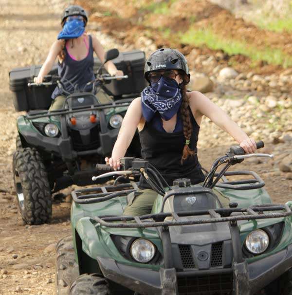 Two girls riding Volare's ATV's