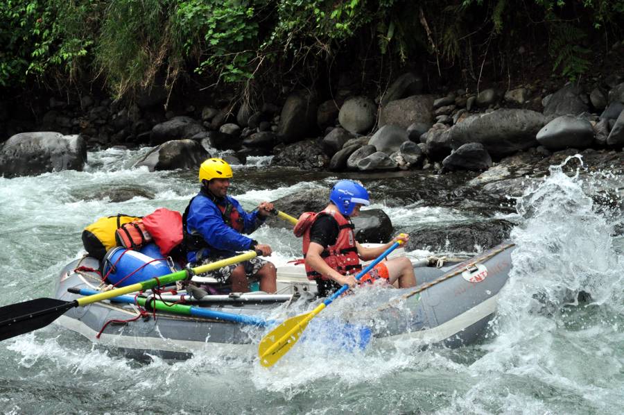 Serendipity guide with young child on whitewater trip